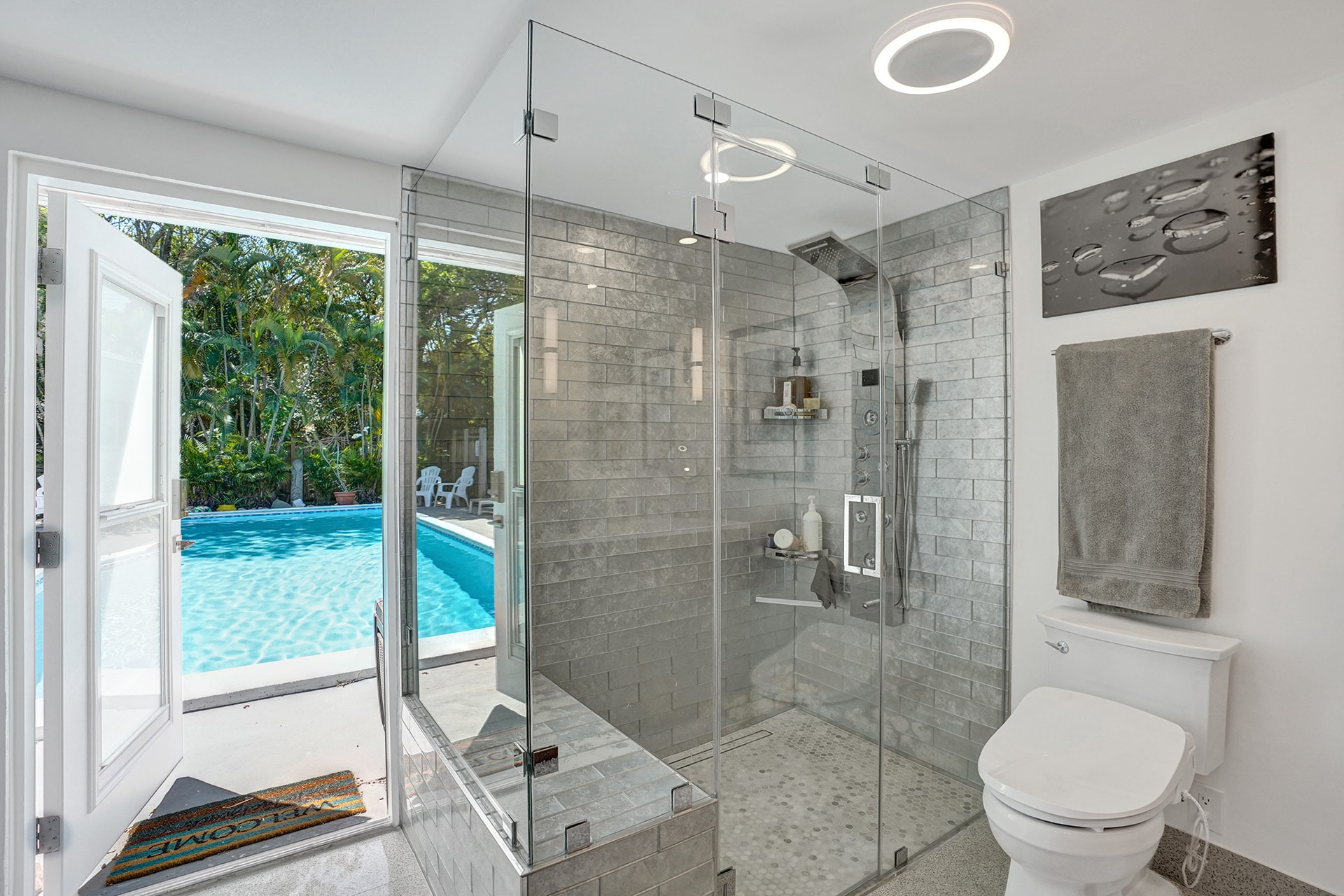 Primary Bathroom with door to pool - 602 NE 37th St