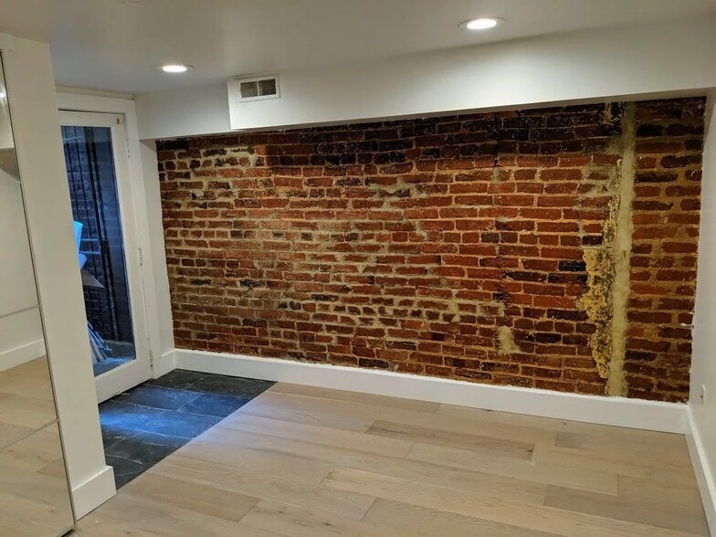 Private entrance/bike storage through 1st bedroom - 1317 Irving St NW