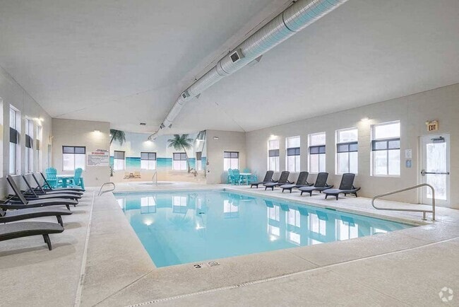 You can take a dip in our sparkling indoor pool year-round! - Pinebrook Apartments