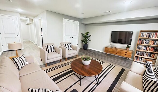 Building Photo - Serrano Townhomes - available now with a finished basement that includes a half bathroom