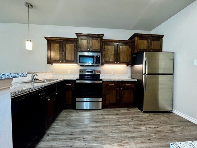 Building Photo - AUGUST MOVE-IN SPECIAL: 4 Private Suites • Walk to Texas Tech • Modern Finishes