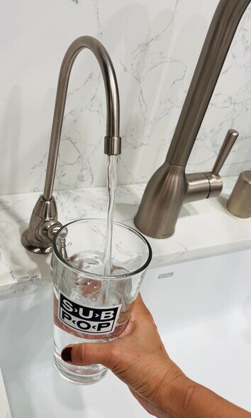 Reverse osmosis water filter built into kitchen counter - 6600 Warner Ave