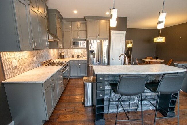 Building Photo - Experience Elevated Living with West Bay V...
