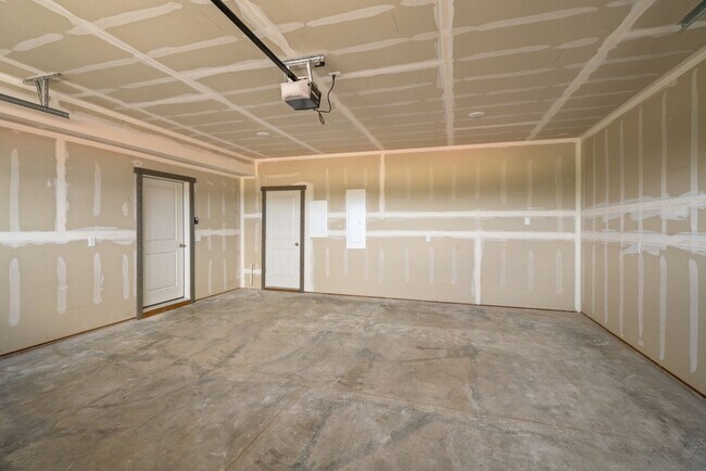 Building Photo - Pet Friendly! Gorgeous 3 Bedroom condo with double stall attached garages with AC.