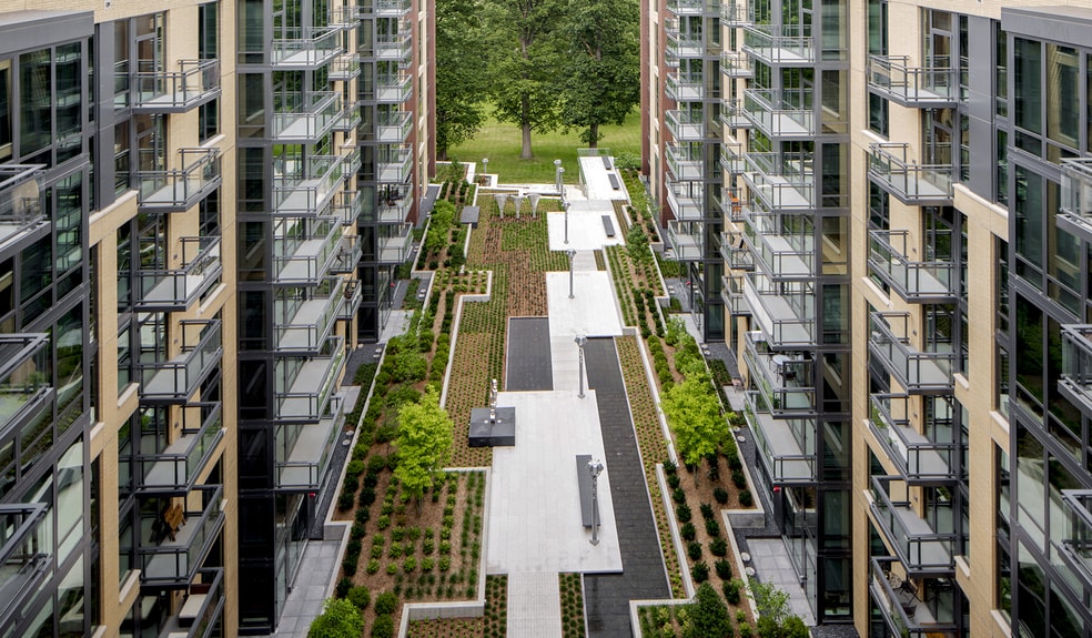 Central courtyard seamlessly integrates with nature - Flats 8300 Apartment Homes