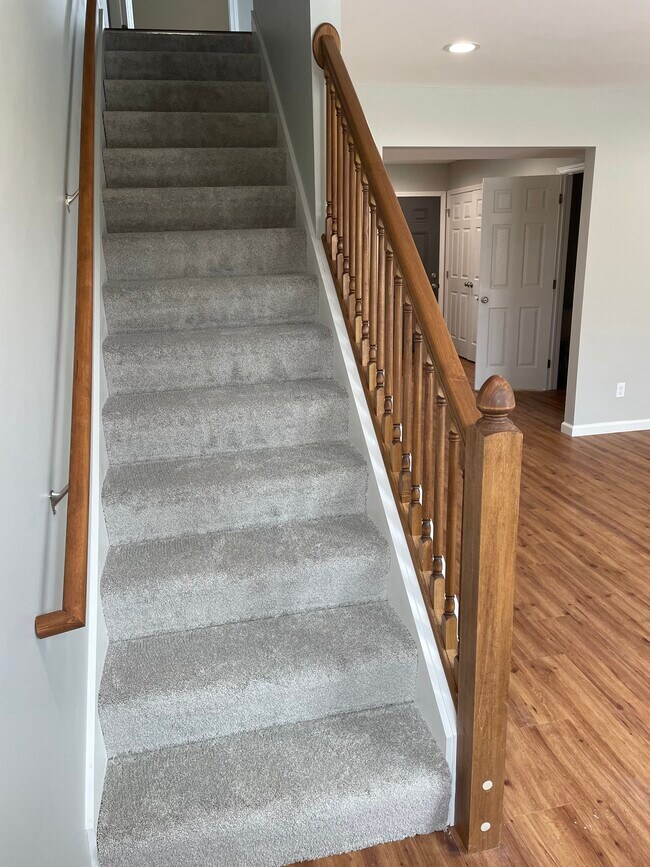 stairs leading to bedrooms and bathroom - 1233 Remington Park Dr