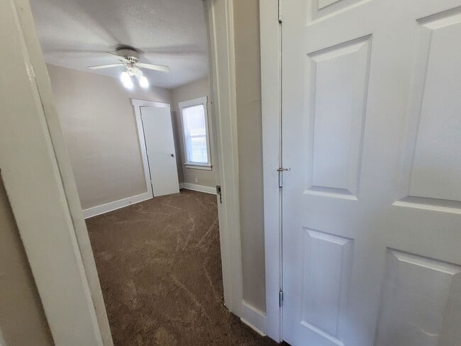 Building Photo - Four bedroom home on Indianola Ave with large yard and two decks!