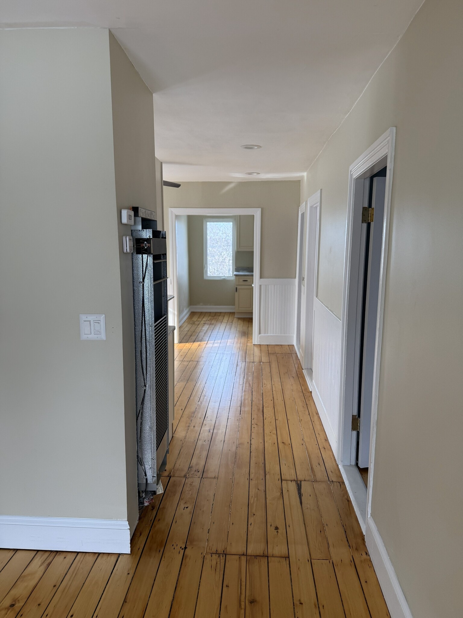 Front door view through kitchen view. Note: heater cover removed for painting purposes - 16 Tecumseh Street