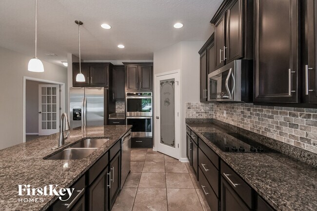 Building Photo - 4550 Plantation Oaks Blvd