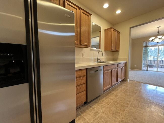 Building Photo - Inviting Two-Story 3BR Home Featuring New Carpet, New Stainless Appliances, Spacious Garage Stora...