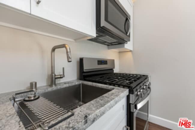 Building Photo - 7851 Airlane Ave