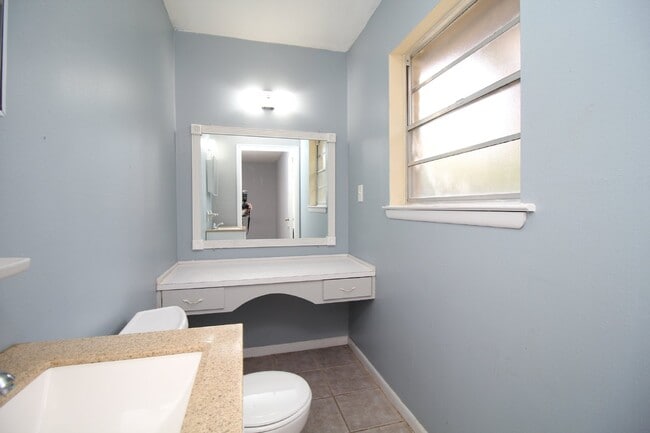 Building Photo - Spacious 3BR/1.5BA Home in Pace with Open Living Area, Tiled Family Room, and Fenced Backyard – M...