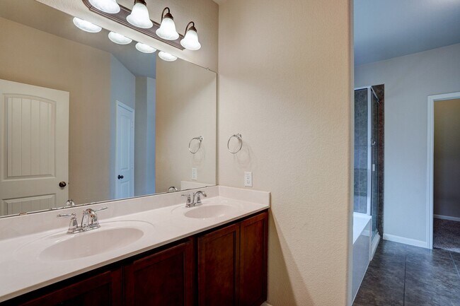 Building Photo - Bright & Roomy 4BR • 2.5BA • Two-Level Living