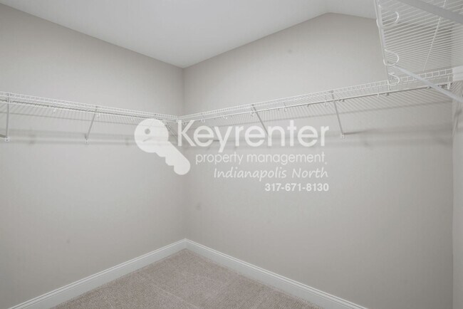 Building Photo - Located in Westfield, IN, this attractive 3-bedroom, 2.5-bath home sits on a corner lot within an...