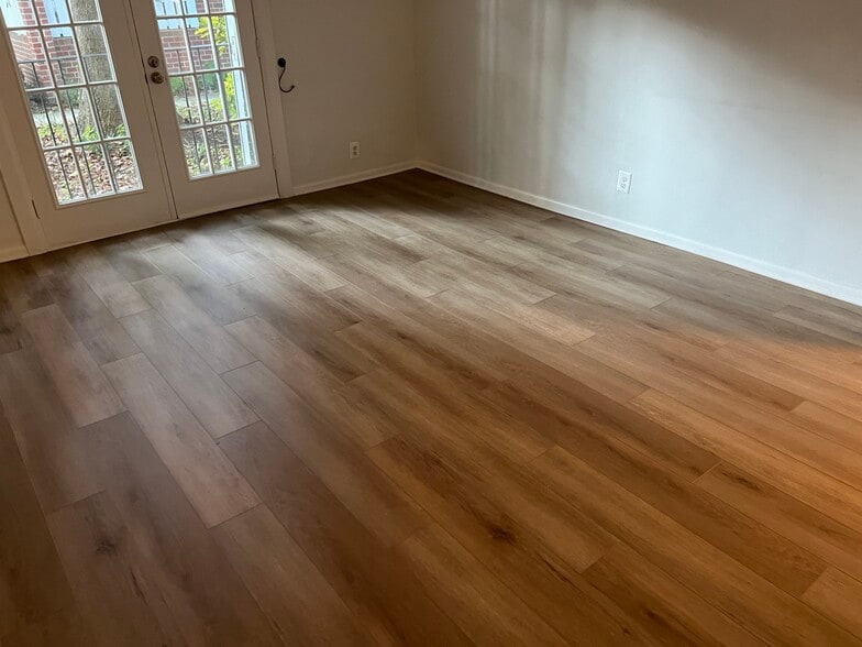 Living room, New floors - 2507 S Walter Reed Dr