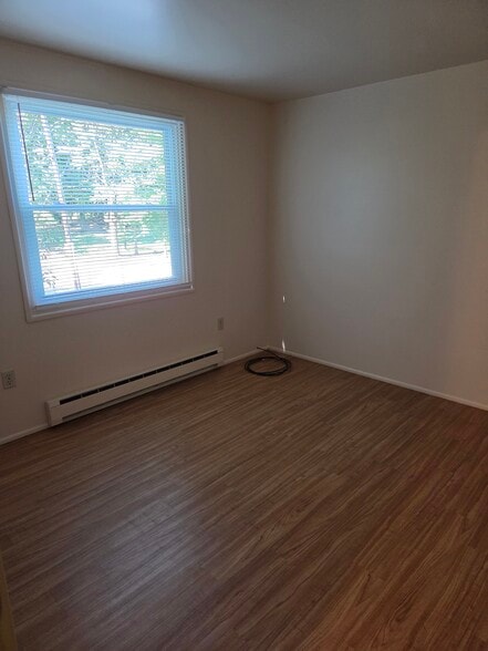 Laminate wood flooring in the second bedroom. - 102 Stonecrest