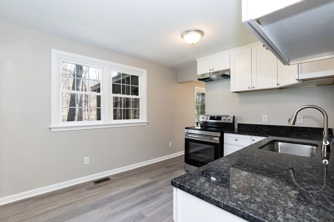 Building Photo - Updated Three Bedroom Home!