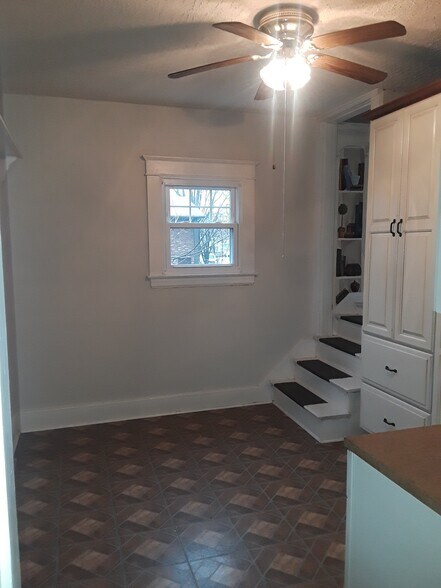 Eat in kitchen with extra cabinetry and access upstairs - 4563 S 1st St