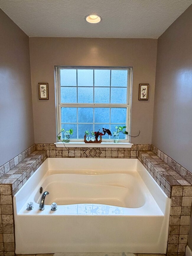 Building Photo - 4/2 with a LARGE fenced in yard!