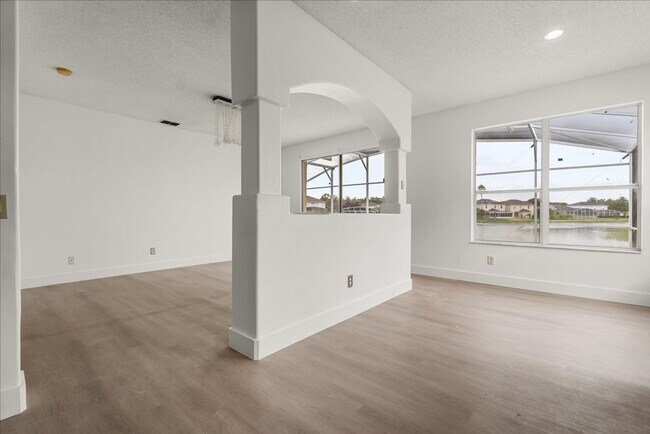 Building Photo - Stunning 4-Bedroom Lakefront Pool Home in Bridgeview at Meadow Woods