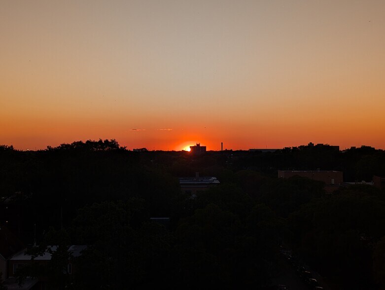 One of many beautiful sunsets captured from the living room - 5400 S Harper Ave