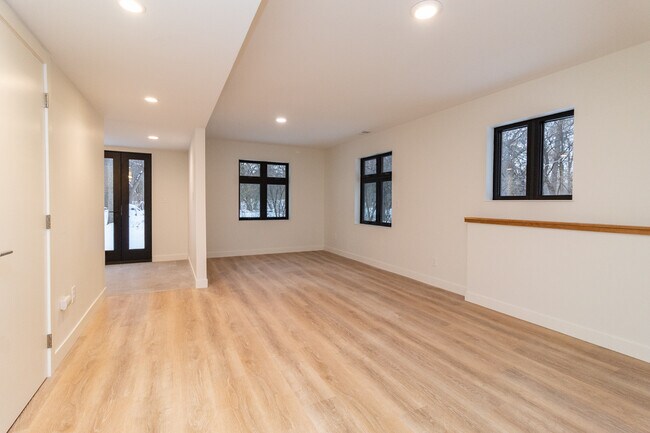 Large family room on walkout level - 5590 Harding Ln