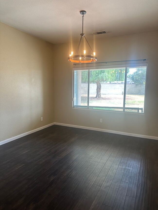 Building Photo - 4 Bedroom, 2 Bathroom Home with a Pool in ...