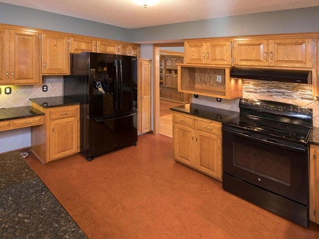 Building Photo - Elegant 2-Story has 4 BRs on Upper Level, Office, 2 Family Rooms, Fireplace & More!