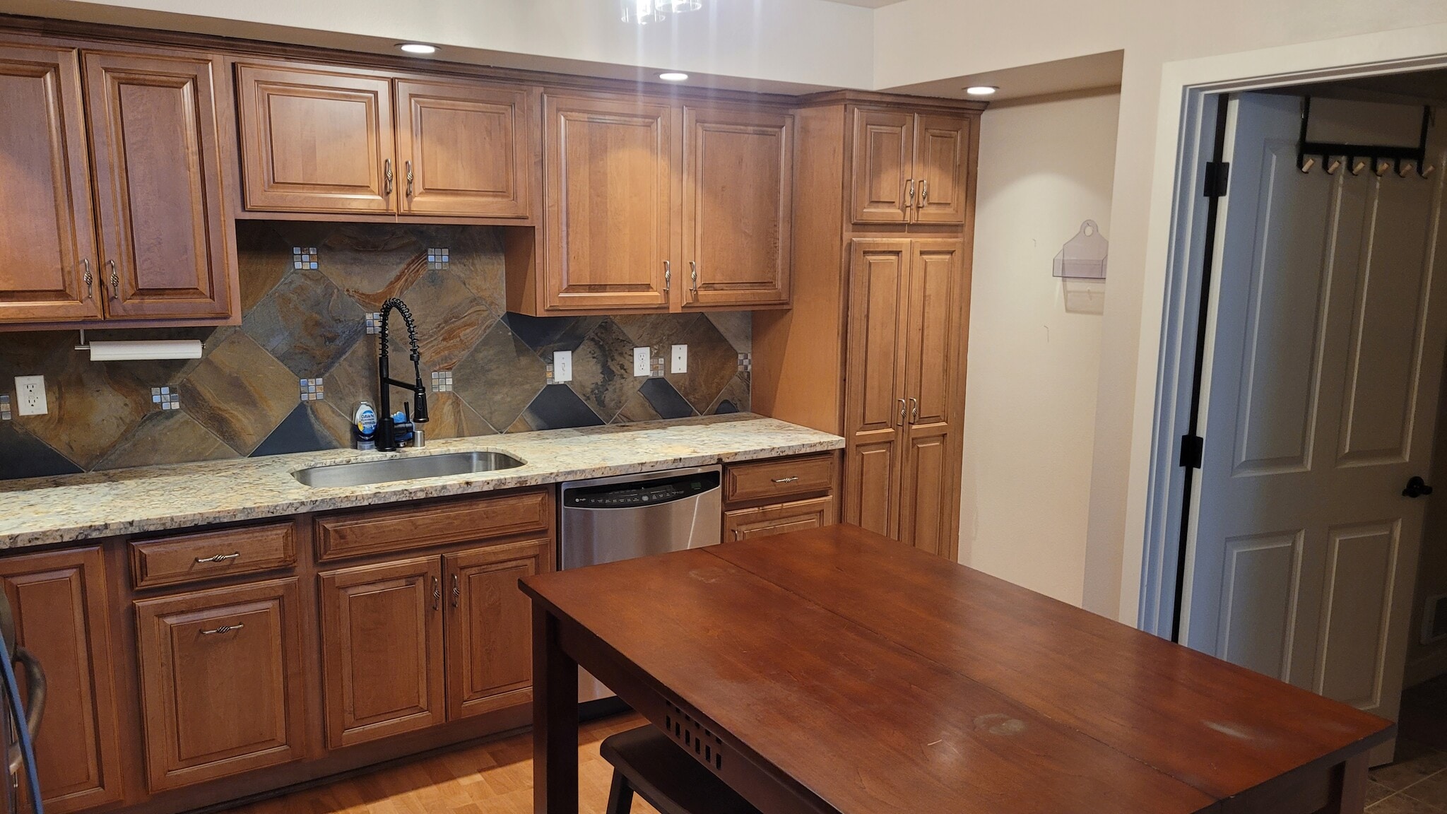 Pantry cupboard, beautiful backsplash and cabinets - 4116 California Ave SW