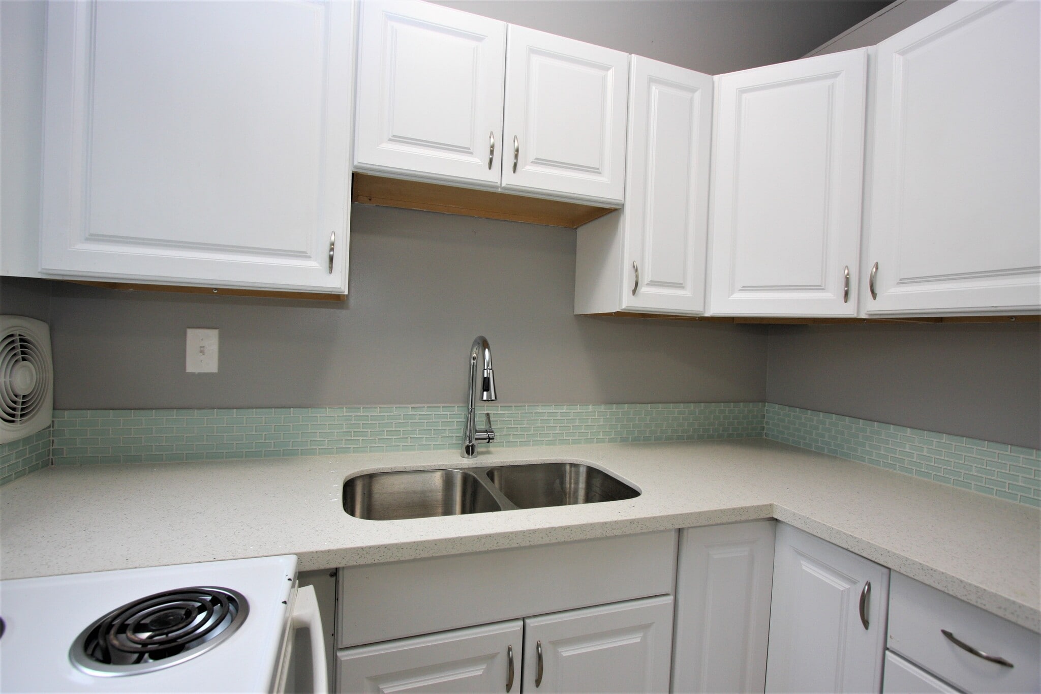 Aqua tile backsplash with new quartz counters. - 5442 -5448 SE Franklin St
