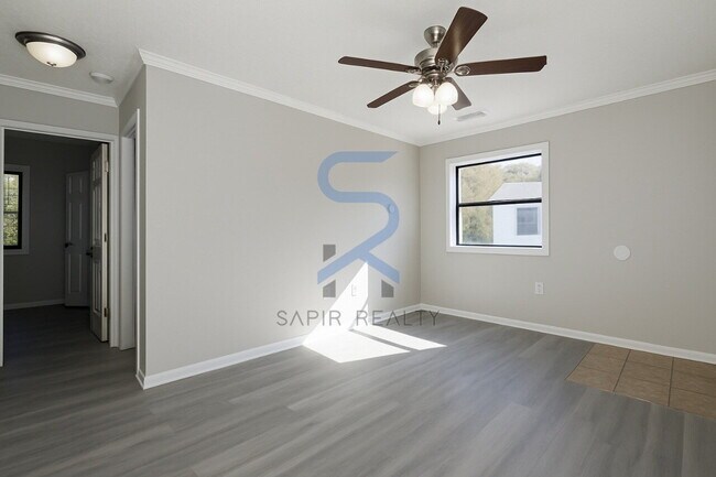 Building Photo - Move in before December 31st and choose your reward: a $250 Amazon Gift Card or a 55" Smart TV!