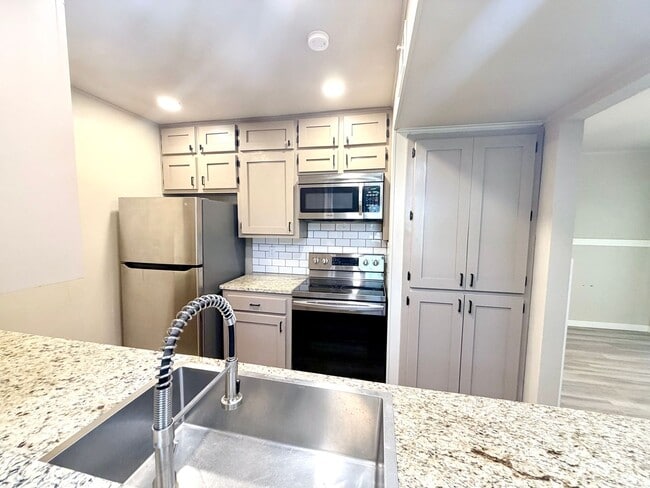 Building Photo - Stylish Two-Story Duplex with Loft, Fireplace & Private Backyard in New Braunfels!