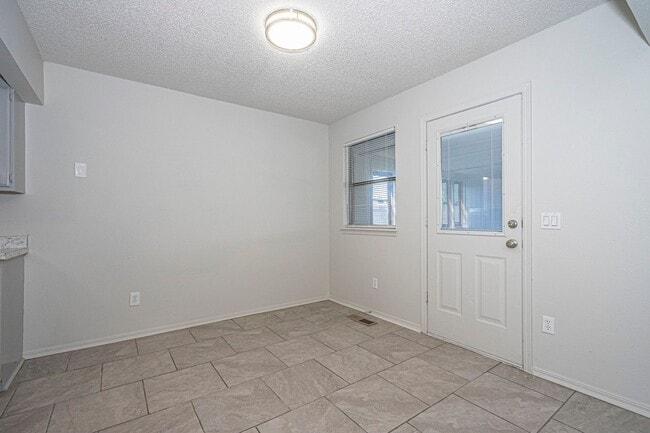 Building Photo - Corner-Lot 3Bedroom Charmer in Yukon with Fireplace & Enclosed Patio!