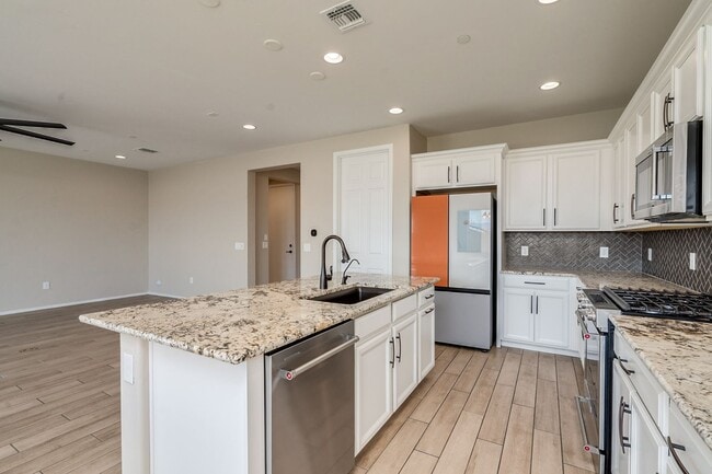 Building Photo - Amazing 4BR 2.5BA Home w/ 3-Car Tandem Garage • Pool Access • Yard w/ Fire Pit in Saguaro Trails