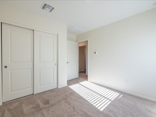 Building Photo - Spacious 4-Bedroom Home with Open Layout & Turf Backyard