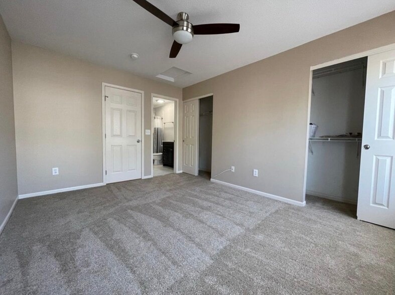 Primary bedroom with attached updated bathroom and walk-in closet. - 289 Preswicke Ml