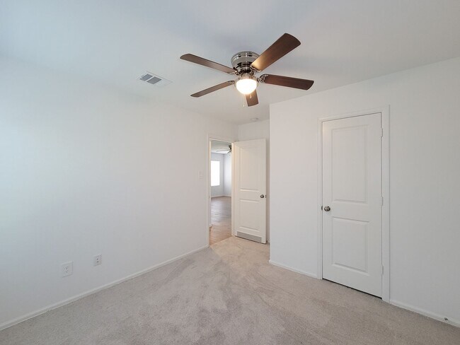 Building Photo - This single-story home has a comfortable layout with three bedrooms and a living area all on one ...