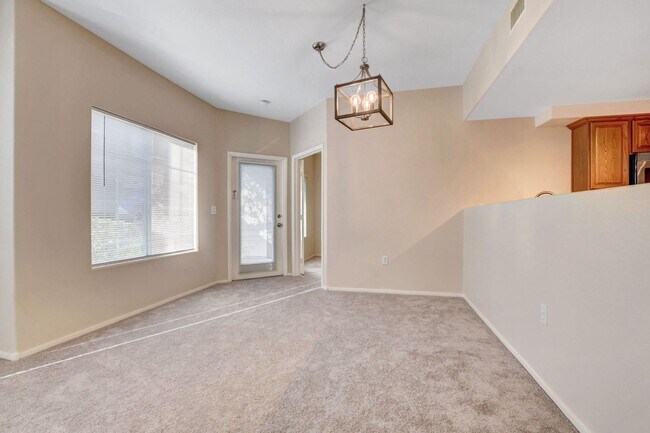 Building Photo - FIRST FLOOR CONDO IN GATED COMMUNITY W/ SINGLE CAR GARAGE