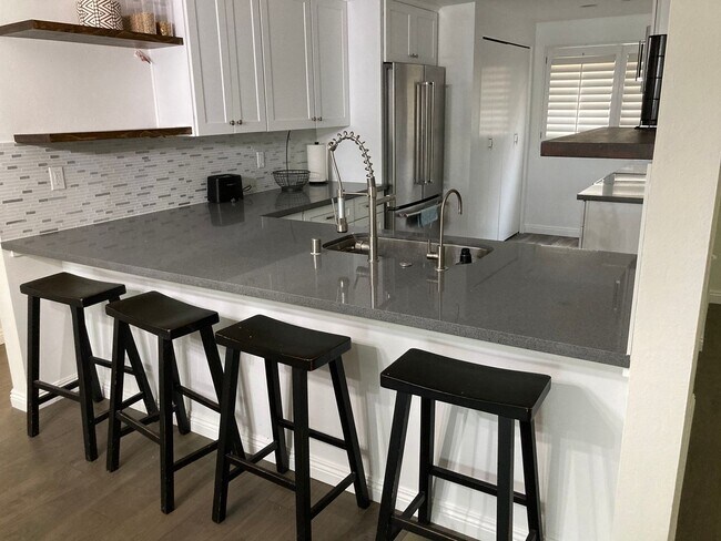 Building Photo - Beachside Furnished Retreat! Remodeled 2BD/2BA Condo Steps from the Sand!
