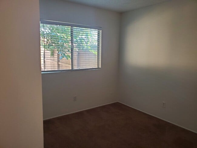 Building Photo - Corner lot detached SFR with a fenced yard in a wonderful neighborhood available 12/20/2025.