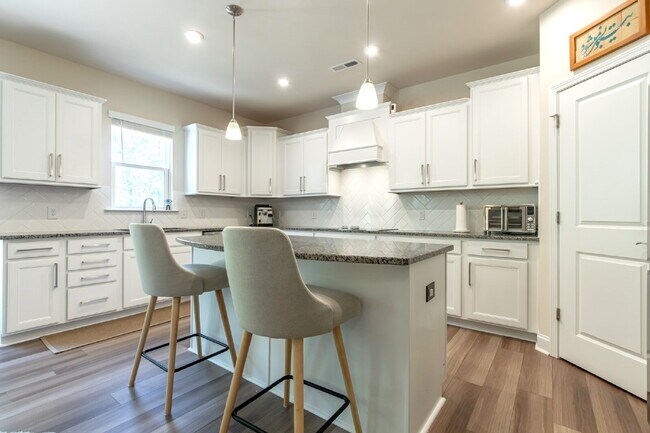 Building Photo - "Discover Spacious Living: 5-Bedroom Craftsman Home in Gated and Amenity-Rich Bretagne with Top-R...