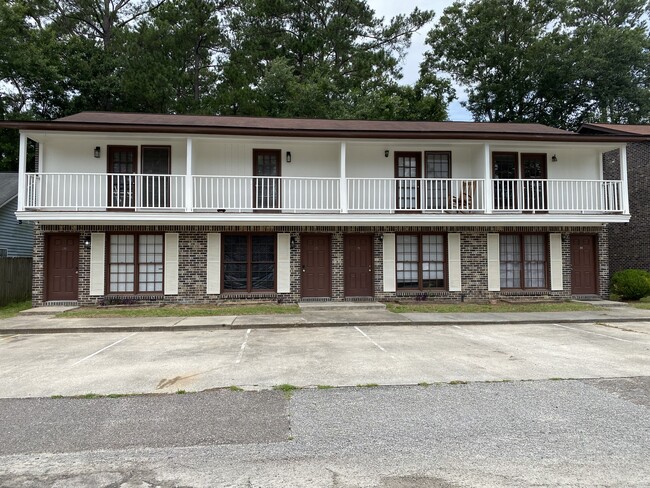 Beautifully maintained brick building with 2 dedicated parking spaces for each unit - 114 Colonial Ct