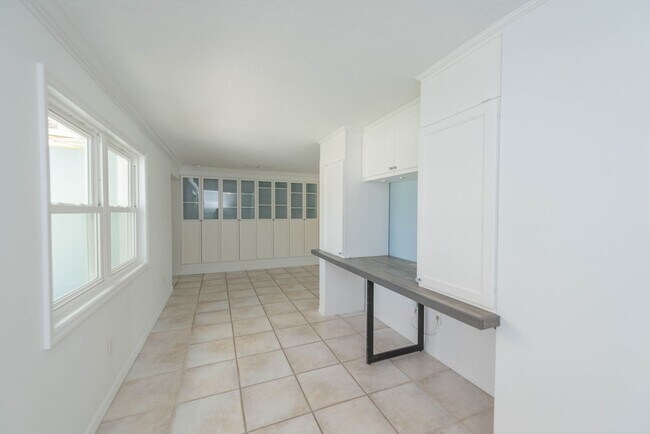 Building Photo - Live the ultimate Space Coast waterfront lifestyle at this stunning beachside canal home in Satel...