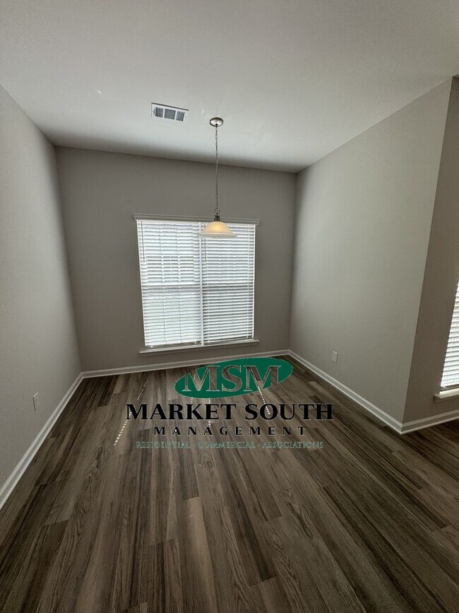 Building Photo - NEW CONSTRUCTION WITH PRIVACY FENCED YARD