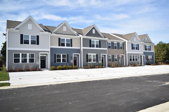 Building Photo - Stunning Brand New Townhome