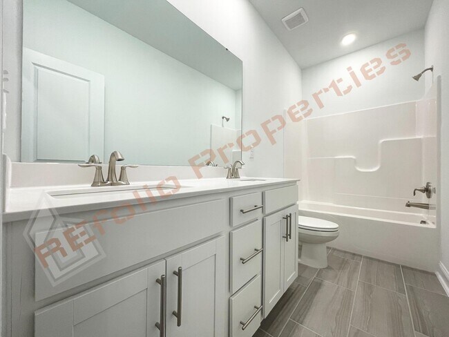 Building Photo - Beautiful Brand New 4 Bedroom, 3 Bathroom Home with 1st Fl Bedroom+  Office, 2-Car-Garage &High-S...