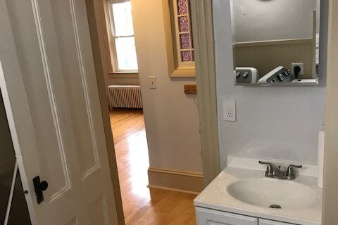Bathroom view to living room. - 15 Congdon Ave