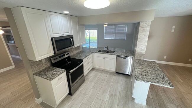 Building Photo - IMMACULATE 4 Bedroom, 2 Bathroom Home in Cocoa Beach!! ONLY MINUTES from the Beach!! (Lawn Care I...