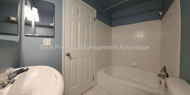 Building Photo - Spacious, Updated Condominium with Two Ful...