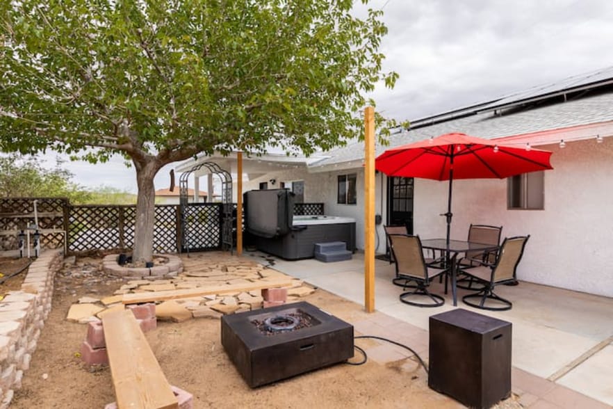 Private outdoor dining table, hot tub, and fire pit - 7084 Hillview Rd